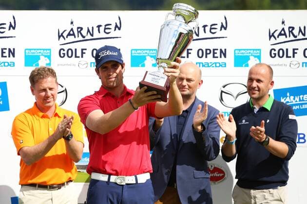 GOLF - Kaernten Golf Open 2015 GOEDERSDORF,AUSTRIA,24.MAY.15 - GOLF - European Challenge Tour, Kaernten Golf Open, GC Schloss Finkenstein, award ceremony. Image shows Peter Hofstaetter (Kaernten Golf Open), the rejoicing of Nacho Elvira (ESP), Christian Kresse (Kaerten Werbung) and Nikolaus Zitny (OEGV). Keywords: trophy. GEPAxpictures xDanielxGoetzhaber