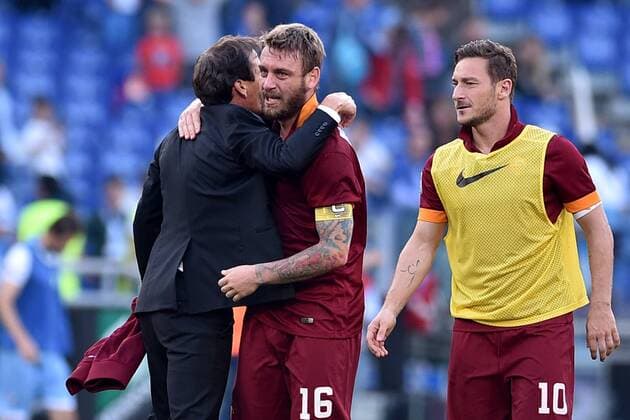 25.05.2015. Rome, Italy. Serie A Football. Lazio versus Roma. Roma s Manager Rudi Garcia, Francesco Totti and Daniele De Rossi celebrate at the end of the match for the victory against Lazio xGiuseppexMaffiax  ActionPlus11624338