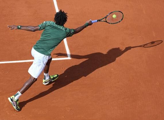 Gael Monfils of France hits a shot during his French Open men s first round match against Edouard Roger-Vasselin of France at Roland Garros in Paris on May 25, 2015. Monfils defeated Roger-Vasselin 6-2, 6-7 (5), 6-1, 7-5 to advance to the second round.  PAR20150525732 DAVIDxSILPA