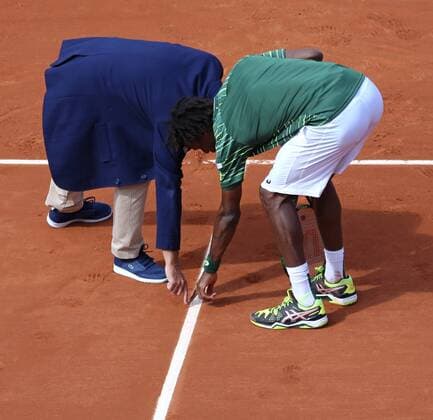 Gael Monfils of France discusses a call with the chair umpire during his French Open men s first round match against Edouard Roger-Vasselin of France at Roland Garros in Paris on May 25, 2015. Monfils defeated Roger-Vasselin 6-2, 6-7 (5), 6-1, 7-5 to advance to the second round.  PAR20150525735 DAVIDxSILPA
