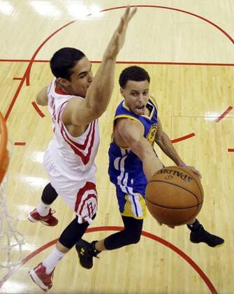 May 23, 2015 - Houston, Texas, U.S - Golden State Warriors guard Stephen Curry (30) shoots as Houston Rockets guard Nick Johnson, left, defends during the second half in Game 3 of the NBA Basketball Herren USA basketball Western Conference finals Saturday, May 23, 2015, in Houston. Warriors vs. Rockets - ZUMAp124