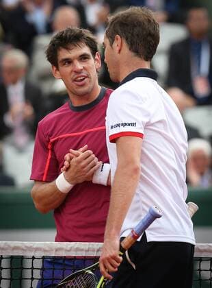 - PARIS, FRANCE: Belgian Germain Gigounon and French Richard Gasquet shake hands at the end of the first round game of the women s singles tournament at the Roland Garros tennis tournament, between Belgian Alison Van Uytvanck and Slovakia s Anna Karolina Schmiedlova, in Paris, France, Tuesday 26 May 2015. Roland Garros Grand Slam takes place from 24 May to 07 June 2015. Gasquet won 6-3, 6-4, 6-0. VIRGINIExLEFOUR  x04630941x