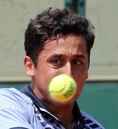 Nicolas Almagro of Spain watches the ball during his French Open men s first round match against Alexandr Dolgopolov of Ukraine at Roland Garros in Paris on May 26, 2015. Almagro defeated Dolgopolov 6-3, 2-6, 6-4, 7-6 (6) to advance to the second round.  PAR20150526718 DAVIDxSILPA