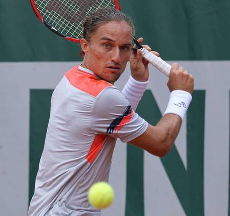 Alexandr Dolgopolov of Ukraine hits a shot during his French Open men s first round match against Nicolas Almagro of Spain at Roland Garros in Paris on May 26, 2015. Almagro defeated Dolgopolov 6-3, 2-6, 6-4, 7-6 (6) to advance to the second round.  PAR20150526723 DAVIDxSILPA