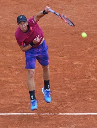 Jarkko Nieminen of Finland hits a serve during his French Open men s first round match against Novak Djokovic of Serbia at Roland Garros in Paris on May 26, 2015. Djokovic defeated Nieminen 6-2, 7-5, 6-2 to advance to the second round.  PAR20150526727 DAVIDxSILPA
