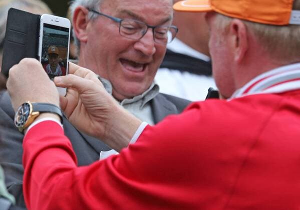 Boris Becker (R) takes a selfie after the French Open men s first round match between Novak Djokovic of Serbia and Jarkko Nieminen of Finland at Roland Garros in Paris on May 26, 2015. Djokovic defeated Nieminen 6-2, 7-5, 6-2 to advance to the second round.  PAR20150526759 DAVIDxSILPA