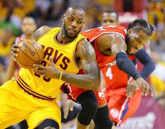 May 26, 2015 - Cleveland, OH, USA - Cleveland Cavaliers LeBron James and Atlanta Hawks DeMarre Carroll battle for a loose ball during Game 4 of the Eastern Conference Finals on Tuesday, May 26, 2015, at Quicken Loans Arena in Cleveland, Ohio. Atlanta Hawks at Cleveland Cavaliers - ZUMAm67_