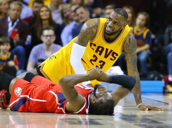 May 26, 2015 - Cleveland, OH, USA - Cleveland Cavaliers LeBron James comes up smiling after colliding with Atlanta Hawks defender DeMarre Carroll in a floor scramble for a loose ball during Game 4 of the Eastern Conference Finals on Tuesday, May 26, 2015, at Quicken Loans Arena in Cleveland, Ohio. Atlanta Hawks at Cleveland Cavaliers - ZUMAm67_