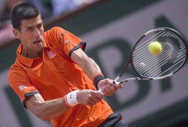 (150527) -- PARIS, May 26, 2015 -- Novak Djokovic of Serbia hits a return during the men s singles first round match against Jarkko Nieminen of Finland at 2015 French Open tennis tournament at Roland Garros, in Paris, France on May 26, 2015. Novak Djokovic won 3-0. )(lm) (SP)FRANCE-PARIS-TENNIS-OPEN ChenxXiaowei 