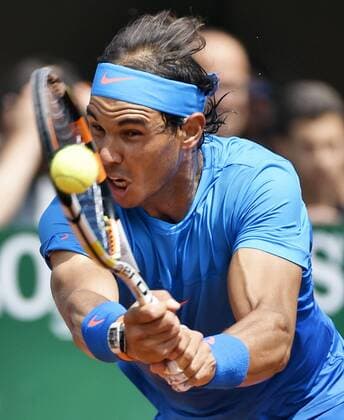 Nadal cruises into French Open 2nd round Rafael Nadal of Spain returns a shot in a first-round match against Quentin Halys of France at the French Open tennis tournament in Paris on May 26, 2015. Nadal, who is chasing his 10th Roland Garros title, won 6-3, 6-3, 6-4. 