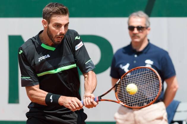 Marcel Granollers of Spain in action in a 2nd round match against Roger Federer of Switzerland on day three of the 2015 French Open tennis tournament at Roland Garros in Paris, France. Sydney Low Cal Media. Tennis 2015: French Open MAY 27 - ZUMAc04_