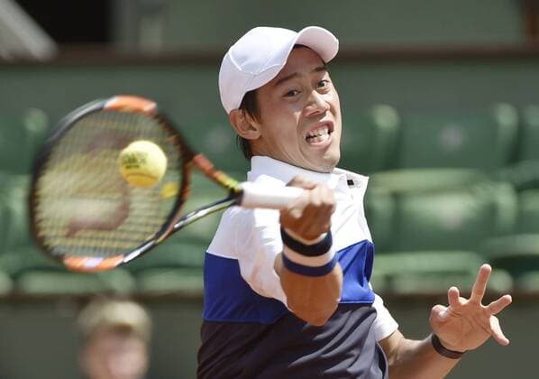 Nishikori competes with Bellucci Japan s Kei Nishikori returns a shot during a French Open second round match against Thomaz Bellucci of Brazil on May 27, 2015, in Paris. 
