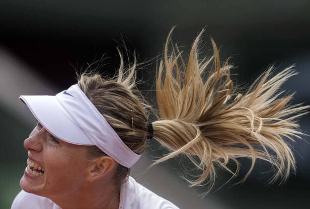 (150527) -- PARIS, May 27, 2015 -- Maria Sharapova of Russia serves during the women s singles second round match against her compatriot Vitalia Diatchenko at 2015 French Open tennis tournament at Roland Garros, in Paris, France on May 27, 2015. Sharapova won 2-0. ) (SP) FRANCE-PARIS-TENNIS-FRENCH OPEN-DAY 4 ChenxXiaowei 