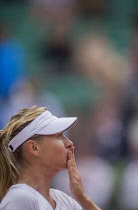 (150527) -- PARIS, May 27, 2015 -- Maria Sharapova of Russia blows a kiss to the crowd after winning the women s singles second round match against her compatriot Vitalia Diatchenko at 2015 French Open tennis tournament at Roland Garros, in Paris, France on May 27, 2015. Sharapova won 2-0. ) (SP) FRANCE-PARIS-TENNIS-FRENCH OPEN-DAY 4 ChenxXiaowei 