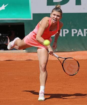 Simona Halep of Romania hits a serve during her French Open women s second round match against Mirjana Lucic-Baroni of Croatia at Roland Garros in Paris on May 27, 2015. Lucic-Baroni defeated Halep 7-5, 6-1 to advance to the next round.  PAR20150527705 DAVIDxSILPA