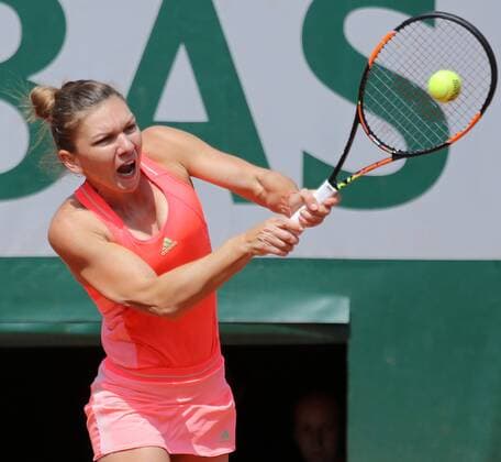 Simona Halep of Romania hits a shot during her French Open women s second round match against Mirjana Lucic-Baroni of Croatia at Roland Garros in Paris on May 27, 2015. Lucic-Baroni defeated Halep 7-5, 6-1 to advance to the next round.  PAR20150527706 DAVIDxSILPA