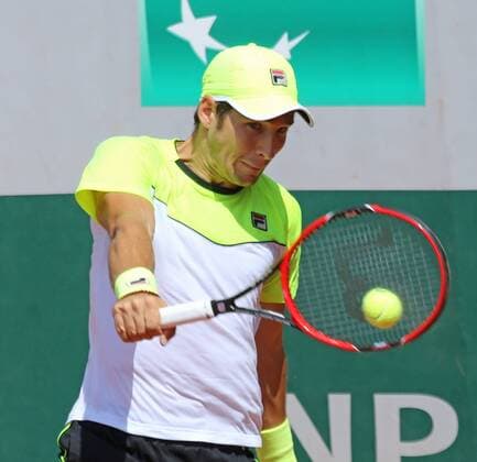 Dusan Lajovic of Serbia and Montenegro hits a shot during his French Open men s second round match against Stan Wawrinka of Switzerland at Roland Garros in Paris on May 27, 2015. Wawrinka defeated Lajovic 6-3, 6-4, 5-7, 6-3 to advance to the next round.  PAR20150527726 DAVIDxSILPA