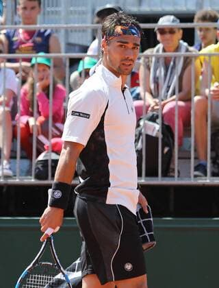 Fabio Fognini of Italy pauses during his French Open men s second round match against Benoit Paire of France at Roland Garros in Paris on May 27, 2015. Paire defeated Fognini 6-1, 6-3, 7-5 to advance to the next round.  PAR20150527748 DAVIDxSILPA
