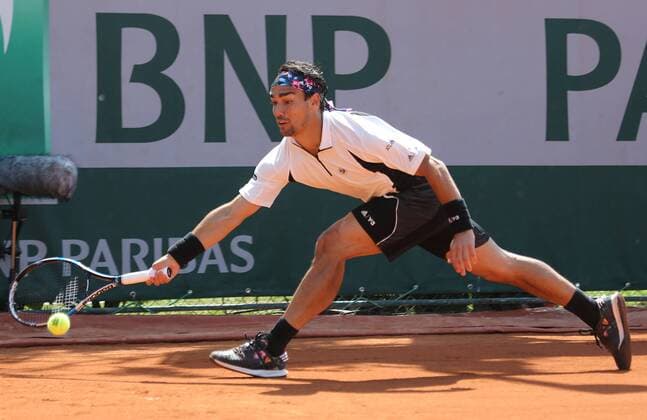 Fabio Fognini of Italy hits a shot during his French Open men s second round match against Benoit Paire of France at Roland Garros in Paris on May 27, 2015. Paire defeated Fognini 6-1, 6-3, 7-5 to advance to the next round.  PAR20150527746 DAVIDxSILPA