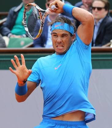 Rafael Nadal of Spain hits a shot during his French Open men s second round match against Nicolas Almagro of Spain at Roland Garros in Paris on May 28, 2015. Nadal defeated Almagro 6-4, 6-3, 6-1 to advance to the next round.  PAR20150528711 DAVIDxSILPA