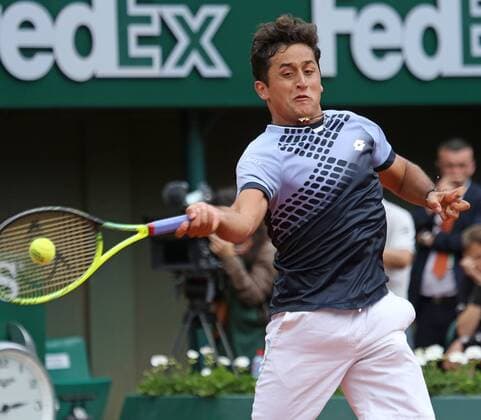Nicolas Almagro of Spain hits a shot during his French Open men s second round match against Rafael Nadal of Spain at Roland Garros in Paris on May 28, 2015. Nadal defeated Almagro 6-4, 6-3, 6-1 to advance to the next round.  PAR20150528714 DAVIDxSILPA