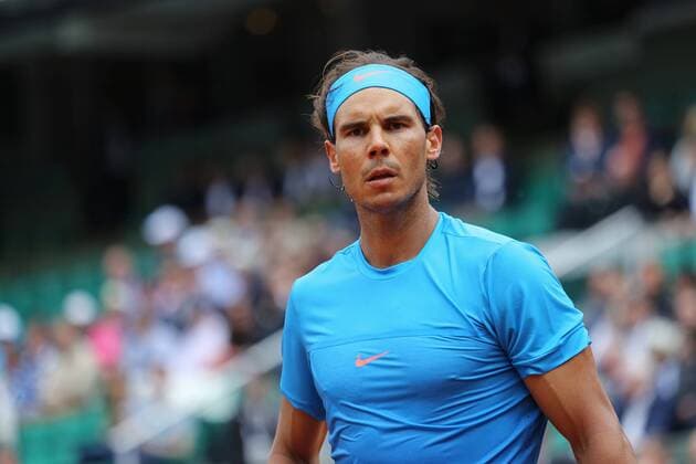 Rafael Nadal of Spain pauses during his French Open men s second round match against Nicolas Almagro of Spain at Roland Garros in Paris on May 28, 2015. Nadal defeated Almagro 6-4, 6-3, 6-1 to advance to the next round.  PAR20150528708 DAVIDxSILPA