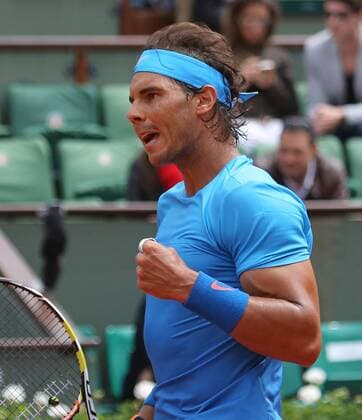 Rafael Nadal of Spain reacts after a shot during his French Open men s second round match against Nicolas Almagro of Spain at Roland Garros in Paris on May 28, 2015. Nadal defeated Almagro 6-4, 6-3, 6-1 to advance to the next round.  PAR20150528712 DAVIDxSILPA