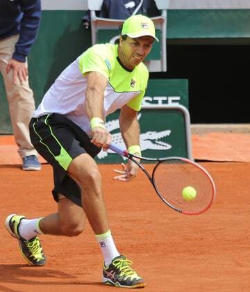 Carlos Berlocq of Argentina hits a shot during his French Open men s second round match against Richard Gasquet of France at Roland Garros in Paris on May 29, 2015. Gasquet defeated Berlocq 3-6, 6-3, 6-1, 4-6, 6-1 to advance to the next round.  PAR20150529711 DAVIDxSILPA