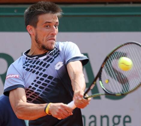 Damir Dzumhur of Bosnia and Herzegovina hits a shot during his French Open men s third round match against Roger Federer of Switzerland at Roland Garros in Paris on May 29, 2015. Federer defeated Dzumhur 6-4, 6-3, 6-2 to advance to the next round.  PAR20150529721 DAVIDxSILPA