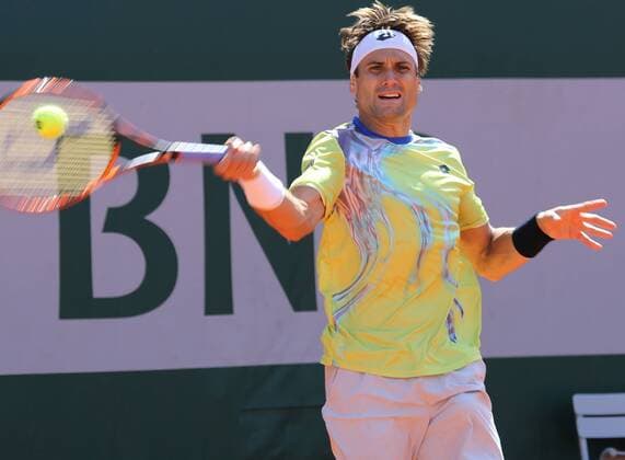 David Ferrer of Spain hits a shot during his French Open men s third round match against Simone Bolelli of Italy at Roland Garros in Paris on May 30, 2015. Ferrer defeated Bolelli 6-1, 1-6, 5-7, 6-0, 6-1 to advance to the next round.  PAR20150530712 DAVIDxSILPA