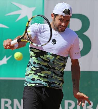 Simone Bolelli of Italy hits a shot during his French Open men s third round match against David Ferrer of Spain at Roland Garros in Paris on May 30, 2015. Ferrer defeated Bolelli 6-1, 1-6, 5-7, 6-0, 6-1 to advance to the next round.  PAR20150530713 DAVIDxSILPA