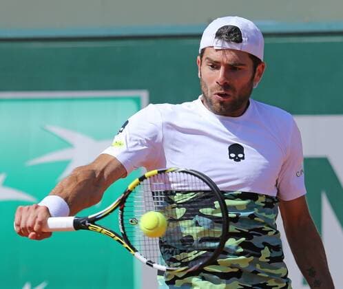 Simone Bolelli of Italy hits a shot during his French Open men s third round match against David Ferrer of Spain at Roland Garros in Paris on May 30, 2015. Ferrer defeated Bolelli 6-1, 1-6, 5-7, 6-0, 6-1 to advance to the next round.  PAR20150530714 DAVIDxSILPA