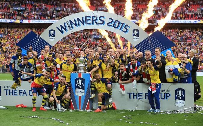 Arsenal s players celebrate with the trophy FA Cup Final - Arsenal vs Aston Villa - Wembley Stadium - England - 30th May 2015 - Picture David Klein Sportimage EDITORIAL USE ONLY. No use with unauthorised audio, video, data, fixture lists, club league logos or live services. Online in-match use limited to 120 images, no video emulation. No use in betting, games or single club league player publications.