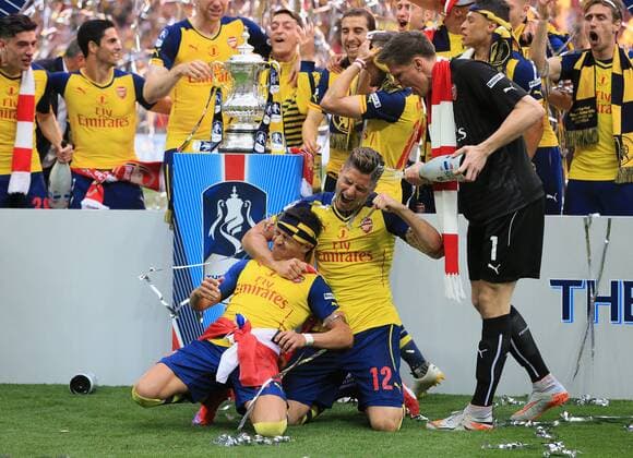 Arsenal s Alexis Sanchez and Olivier Giroud celebrate FA Cup Final - Arsenal vs Aston Villa - Wembley Stadium - England - 30th May 2015 - Picture David Klein Sportimage EDITORIAL USE ONLY. No use with unauthorised audio, video, data, fixture lists, club league logos or live services. Online in-match use limited to 120 images, no video emulation. No use in betting, games or single club league player publications.