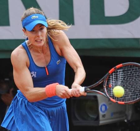Alize Cornet of France hits a shot during her French Open women s fourth round match against Elina Svitolina of Ukraine at Roland Garros in Paris on May 31, 2015. Svitolina defeated Cornet 6-2, 7-6 (9) to advance to the next round.  PAR20150531705 DAVIDxSILPA