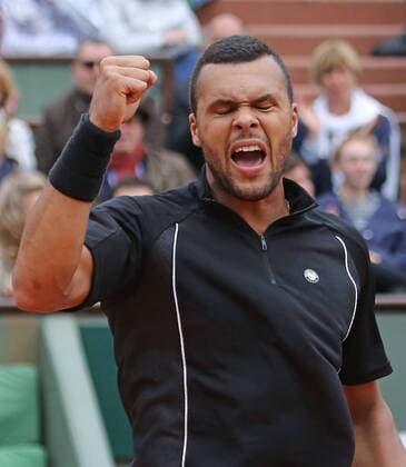 Jo-Wilfried Tsonga of France hits a shot during his French Open men s fourth round match against Tomas Berdych of the Czech Republic at Roland Garros in Paris on May 31, 2015. Tsonga defeated Berdych 6-3, 6-2, 6-7 (5), 6-3 to advance to the next round.  PAR20150531736 DAVIDxSILPA
