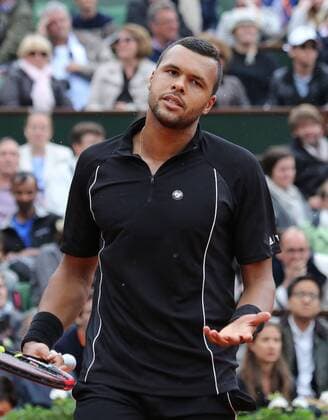 Jo-Wilfried Tsonga of France hits a shot during his French Open men s fourth round match against Tomas Berdych of the Czech Republic at Roland Garros in Paris on May 31, 2015. Tsonga defeated Berdych 6-3, 6-2, 6-7 (5), 6-3 to advance to the next round.  PAR20150531742 DAVIDxSILPA