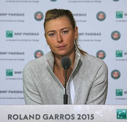 Maria Sharapova speaks to the press after losing her French Open women s fourth round match against Lucie Safarova of the Czech Republic at Roland Garros in Paris on June 1, 2015. Safarova defeated Sharapova 7-6 (3), 6-4 to advance to the next round.  PAR20150601702 DAVIDxSILPA
