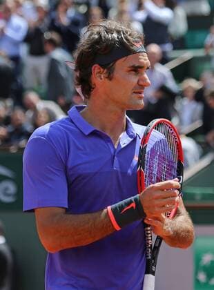 Roger Federer of Switzerland looks in the crowd after winning his French Open men s fourth round match against Gael Monfils of France at Roland Garros in Paris on June 1, 2015. Federer defeated Monfils 6-3, 4-6, 6-4, 6-1 to advance to the next round.  PAR20150601735 DAVIDxSILPA