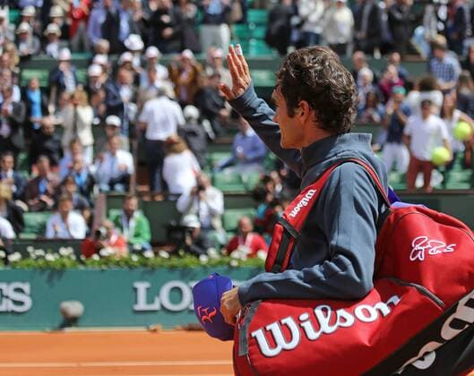 Roger Federer of Switzerland waves to the crowed after winning his French Open men s fourth round match against Gael Monfils of France at Roland Garros in Paris on June 1, 2015. Federer defeated Monfils 6-3, 4-6, 6-4, 6-1 to advance to the next round.  PAR20150601736 DAVIDxSILPA