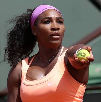 American Serena Williams hits a serve during her French Open women s quarterfinal match against Sara Errani of Italy at Roland Garros in Paris on June 3, 2015. Williams defeated Errani 6-1, 6-3 to advance to the next round.  PAR20150603704 DAVIDxSILPA