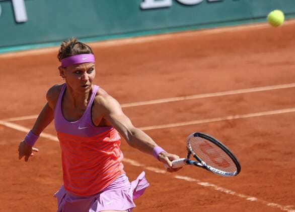 Lucie Safarova of the Czech Republic hits a shot during her French Open women s semifinal match against Ana Ivanovic of Serbia at Roland Garros in Paris on June 4, 2015.  PAR20150604711 DAVIDxSILPA
