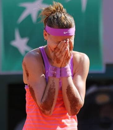 Lucie Safarova of the Czech Republic reacts after winning her French Open women s semifinal match against Ana Ivanovic of Serbia at Roland Garros in Paris on June 4, 2015. Ivanovic defeated Safarova 6-1, 6-3 to advance to the finals.  PAR20150604730 DAVIDxSILPA