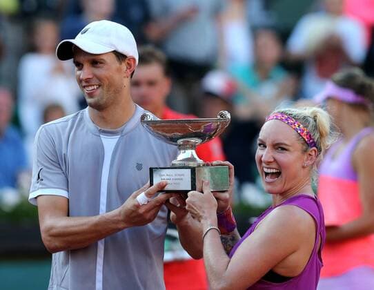 Bethanie Mattek-Sands (R) and Mike Bryan of the United States hold the champion trophy during the awarding ceremony for the mixded doubles final at 2015 French Open tennis tournament in Paris, France on June 4, 2015. The U.S. pair claimed the title of the event after beating Lucie Hradecka of the Czech Republic and Marcin Matkowski of Poland 2-0. ) (SP)FRANCE-PARIS-TENNIS-FRENCH OPEN 2015-MIXED DOUBLES-FINAL HanxYan 