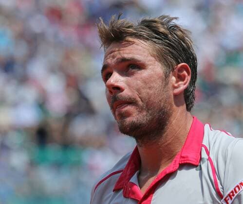 Stan Wawrinka of Switzerland pauses during his French Open men s semifinal match against Jo-Wilfried Tsonga of France at Roland Garros in Paris on June 5, 2015.  PAR20150605710 DAVIDxSILPA