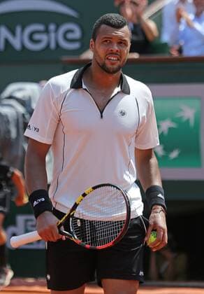 Jo-Wilfried Tsonga of France pauses during his French Open men s semifinal match against Stan Wawrinka of Switzerland at Roland Garros in Paris on June 5, 2015.  PAR20150605714 DAVIDxSILPA