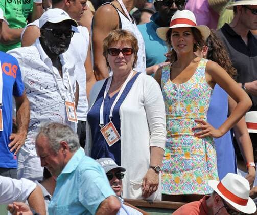 Didier Tsonga (L), Evelyne Tsonga (C) and Noura El Swekh watch the French Open men s semifinal match between Jo-Wilfried Tsonga of France and Stan Wawrinka of Switzerland at Roland Garros in Paris on June 5, 2015.  PAR20150605716 DAVIDxSILPA