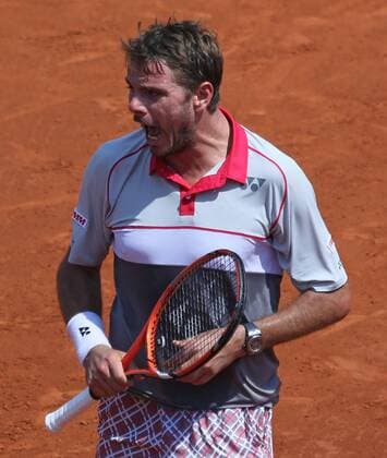 Stan Wawrinka of Switzerland reacts after a shot during his French Open men s semifinal match against Jo-Wilfried Tsonga of France at Roland Garros in Paris on June 5, 2015.  PAR20150605721 DAVIDxSILPA
