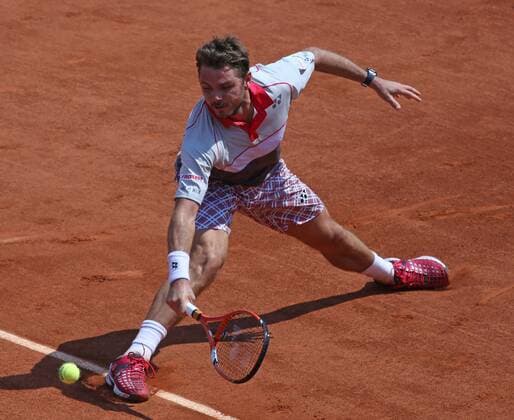 Stan Wawrinka of Switzerland hits a shot during his French Open men s semifinal match against Jo-Wilfried Tsonga of France at Roland Garros in Paris on June 5, 2015.  PAR20150605722 DAVIDxSILPA