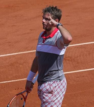 Stan Wawrinka of Switzerland reacts after winning his French Open men s semifinal match against Jo-Wilfried Tsonga of France at Roland Garros in Paris on June 5, 2015. Wawrinka defeated Tsonga 6-3, 6-7 (1), 7-6 (3), 6-4 to advance to the final round.  PAR20150605727 DAVIDxSILPA
